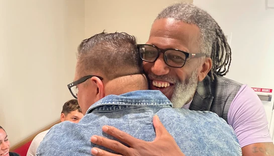 Horace Wilson sharing a moment of encouragement